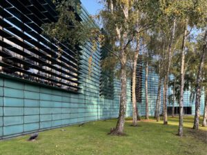 The distinctive façade of the Nordic Embassies in Berlin, wrapped in a turquoise copper band.