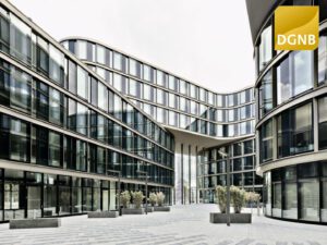 View of the interior courtyard of LTD 1 Hamburg, featuring landscaped green spaces accessible to residents and employees