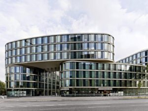Exterior view of LTD 1 Hamburg, showcasing its boomerang-shaped elements and modern facade