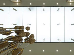 Translucent glass ceiling with a grid of bamboo rod downlights