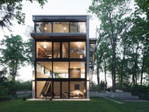 Building nestled among mature trees with views
