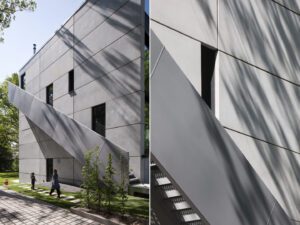 Sculptural external staircase providing access to upper-floor apartments