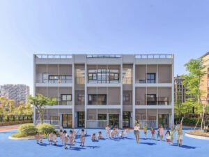 Children engaging in physical activities on the brightly coloured playground