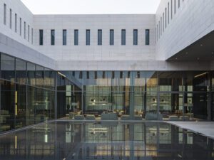 Central courtyard of Assila HQ with stone paving and surrounding office spaces