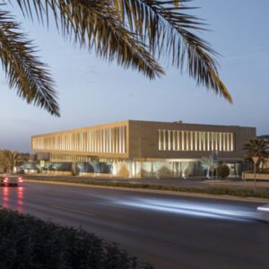 Thumbnail for new sandstone building Assila Investment HQ in Riad with palm trees and DAM Preis nomination logo.